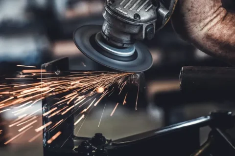 Rope access welder repairing machinery.